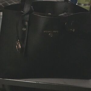 Michael Kors Black cross (x) not accross shoulder strap purse. New with tags .